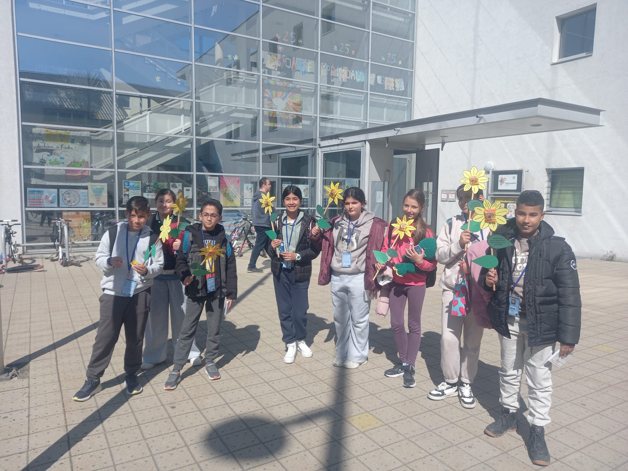 Students proudly displaying their certificates of completion